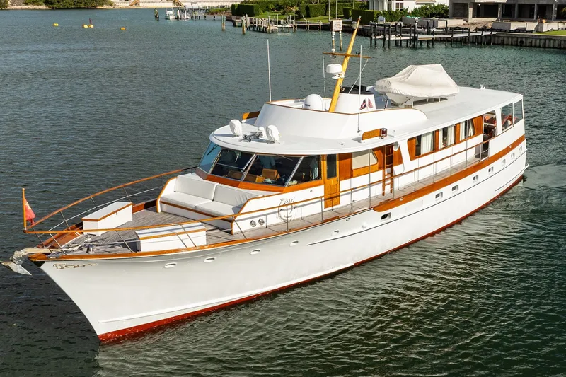 Slide: The Image of Classic 1972 Trumpy 72 Motor Yacht cruising on calm waters. - 4