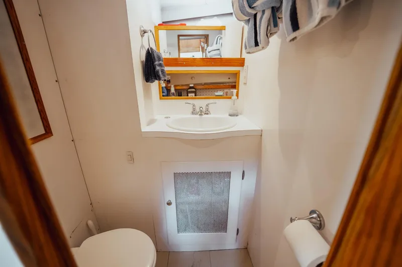 Slide: The Image of Bathroom interior of 1972 Trumpy 72 Motor Yacht with sink and mirror. - 41