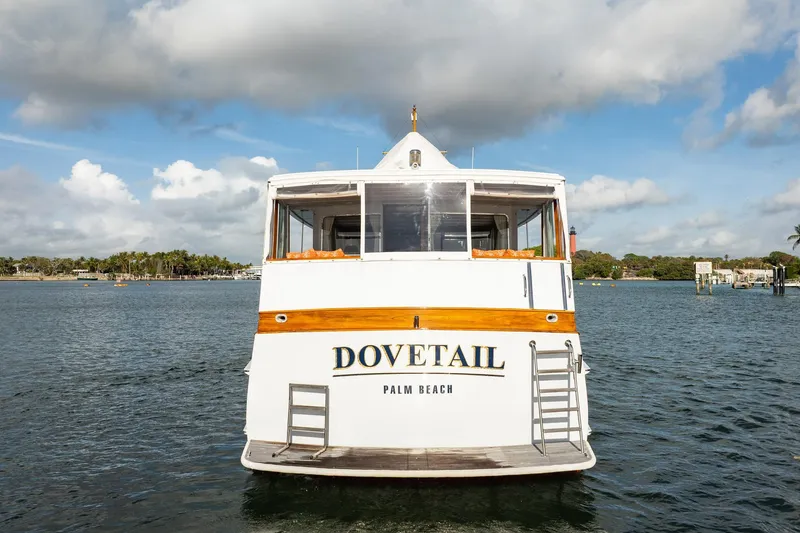 Slide: The Image of 1972 Trumpy 72 Motor Yacht "Dovetail" on water, Palm Beach backdrop. - 7