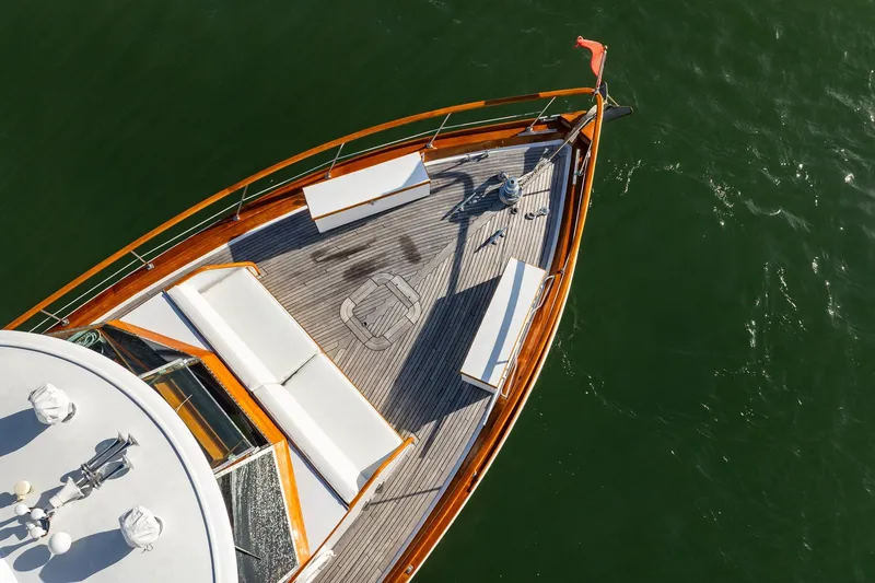 Slide: The Image of Aerial view of 1972 Trumpy 72 Motor Yacht deck with seating, on calm water. - 8