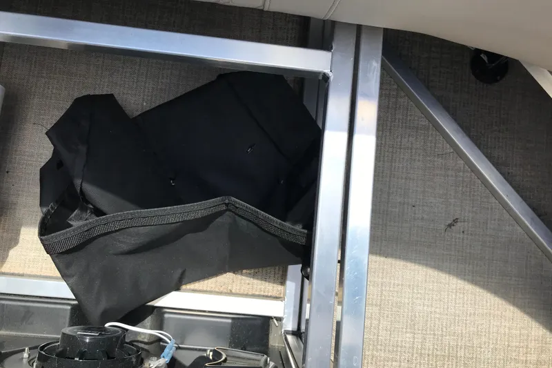 Slide: The Image of Interior view of 2026 Avalon LSZ Quad Lounge Tri Log with black storage bag. - 13