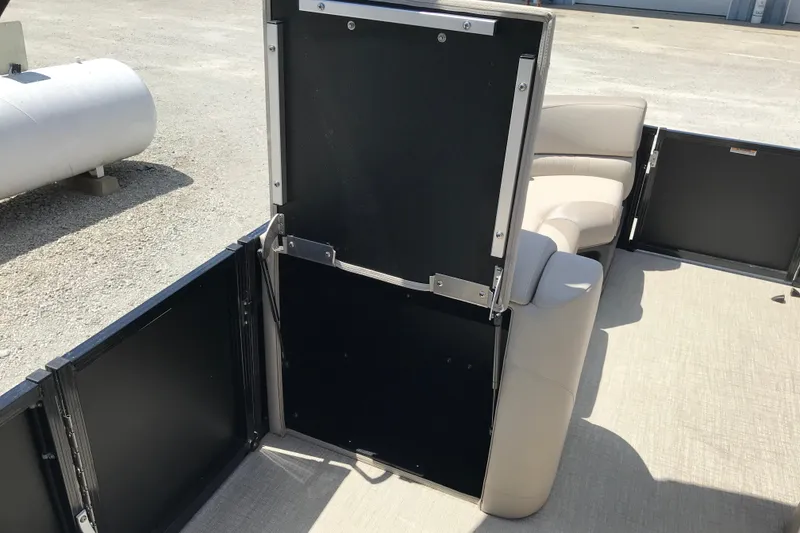 Slide: The Image of 2026 Avalon LSZ Quad Lounge Tri Log interior with open gate and seating. - 17