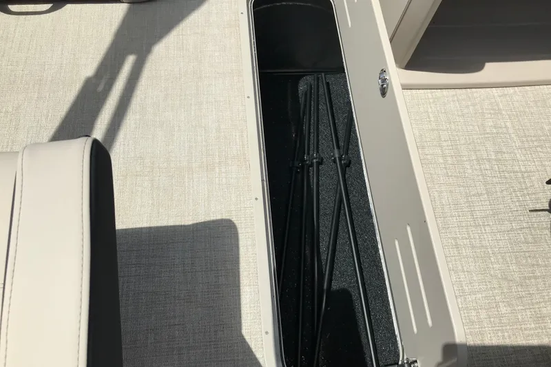 Slide: The Image of 2026 Avalon LSZ Quad Lounge Tri Log boat interior storage compartment. - 20