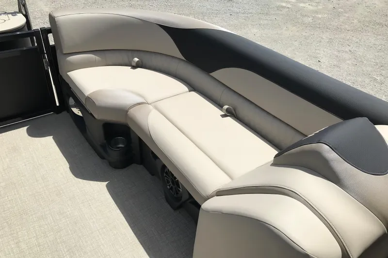 Slide: The Image of Luxurious seating on 2026 Avalon LSZ Quad Lounge Tri Log boat, featuring beige and black upholstery. - 22
