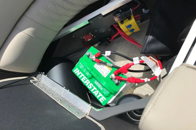 Slide: The Image of Battery compartment of 2026 Avalon LSZ Quad Lounge Tri Log with Interstate battery installed. - 23