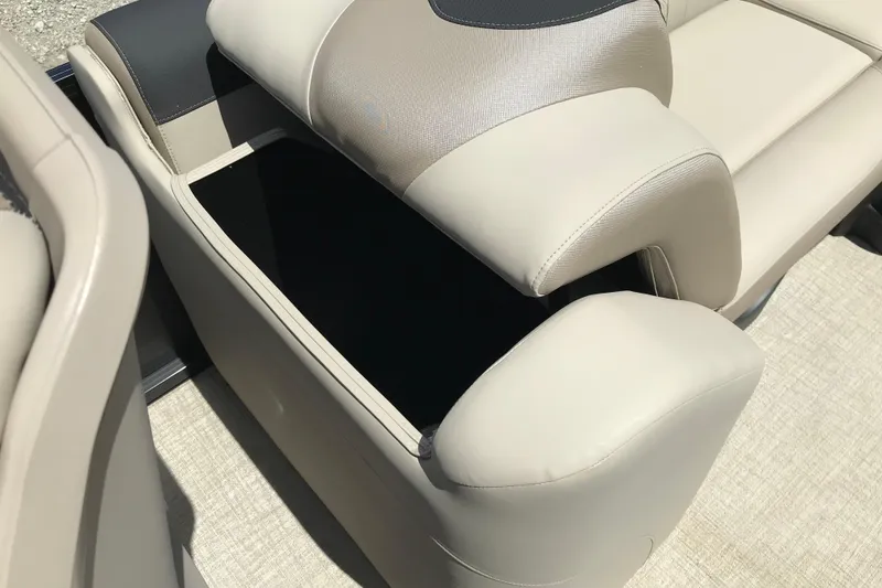 Slide: The Image of 2026 Avalon LSZ Quad Lounge Tri Log boat seat with open storage compartment. - 25
