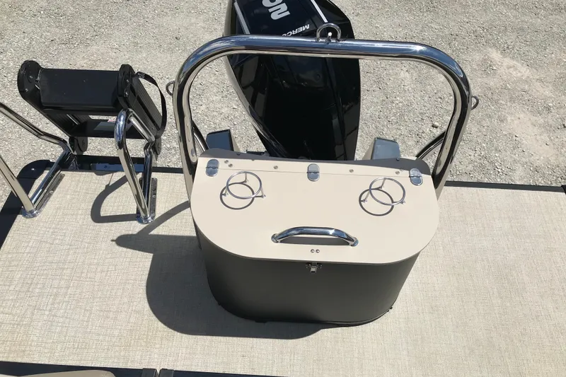 Slide: The Image of 2026 Avalon LSZ Quad Lounge Tri Log boat with rear seating and motor. - 29
