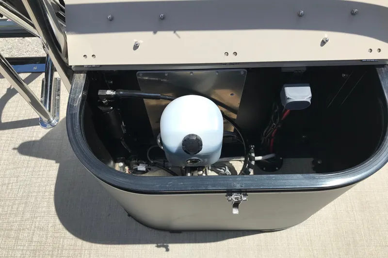Slide: The Image of Open storage compartment of 2026 Avalon LSZ QUAD LOUNGE TRI LOG boat. - 30