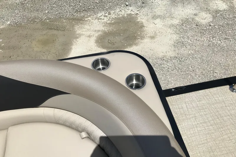 Slide: The Image of Luxurious seating and cup holders on 2026 Avalon LSZ Quad Lounge Tri Log boat. - 32