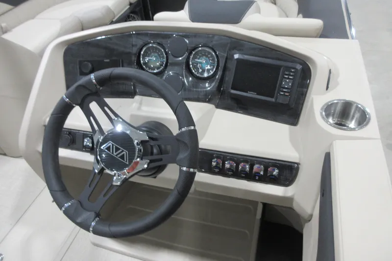 Slide: The Image of Steering console of 2026 Avalon LSZ Quad Lounge Tri Log boat with modern controls. - 6
