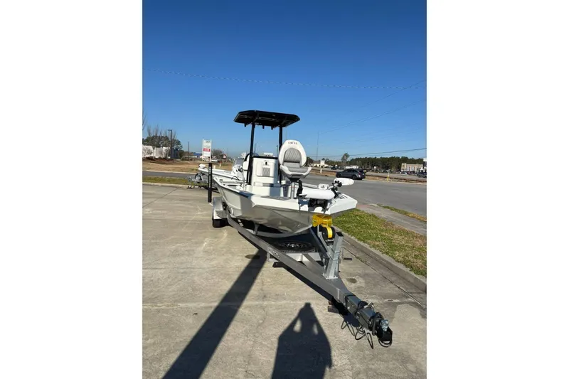 Slide: The Image of 2026 Excel 230 Bay Pro Elite boat on trailer, parked outdoors under clear sky. - 8
