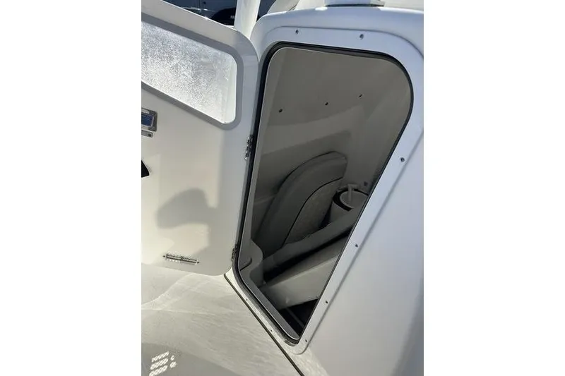 Slide: The Image of 2022 Sea Fox 288 Commander boat interior storage compartment with open door. - 13