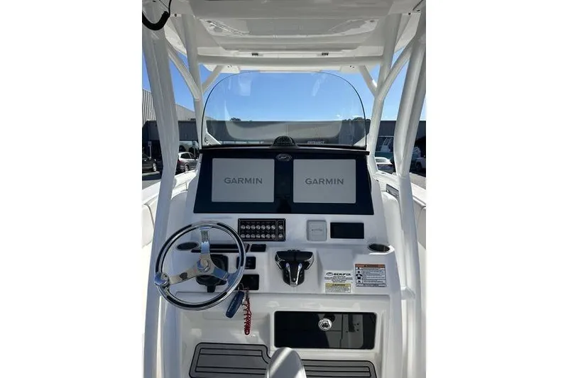 Slide: The Image of 2022 Sea Fox 288 Commander boat dashboard with dual Garmin displays. - 8