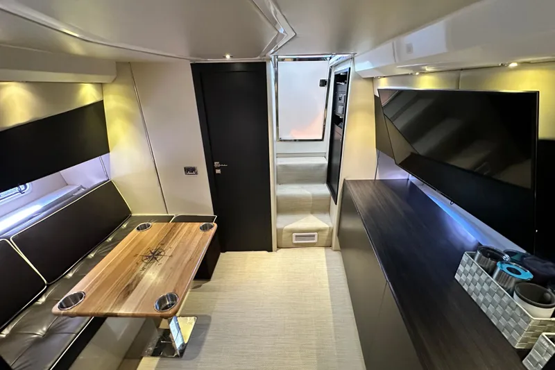 Slide: The Image of Luxurious interior of 2013 Azimut Verve 40 yacht with modern seating and entertainment area. - 77