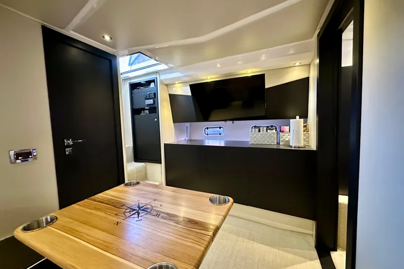 Slide: The Image of Luxurious interior of 2013 Azimut Verve 40 yacht with modern amenities and wooden table. - 80