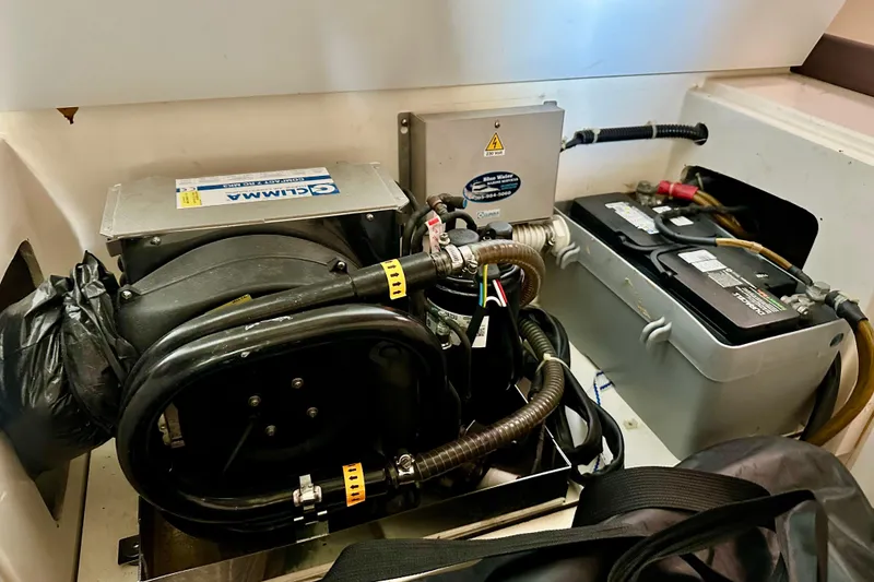 Slide: The Image of Engine compartment of a 2013 Azimut Verve 40 yacht, featuring mechanical components and battery. - 86