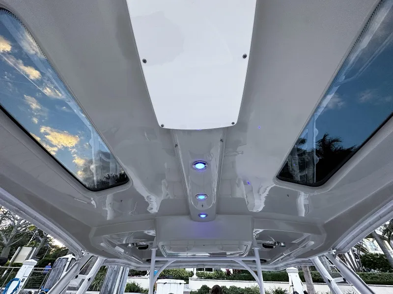 Slide: The Image of 2017 Everglades 360 LXC boat interior ceiling with skylights and LED lights. - 18