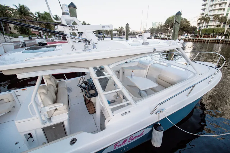 Slide: The Image of 2017 Everglades 360 LXC boat docked, featuring spacious seating and sleek design. - 8