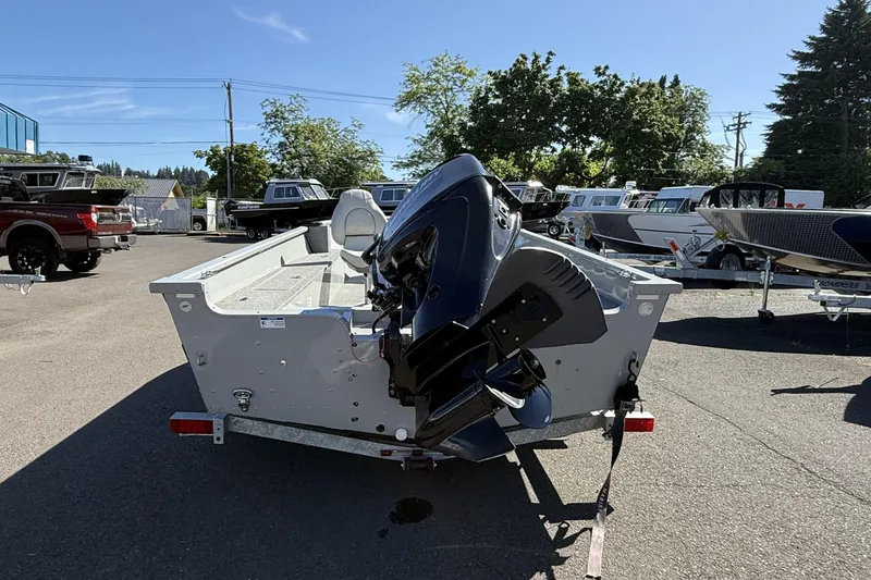 Slide: The Image of 2022 Smoker Craft Freedom 160 SC boat with outboard motor in a dealership lot. - 8