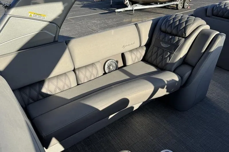 Slide: The Image of Luxurious seating in 2024 Bennington 25 QXSBA pontoon boat, featuring elegant upholstery. - 11