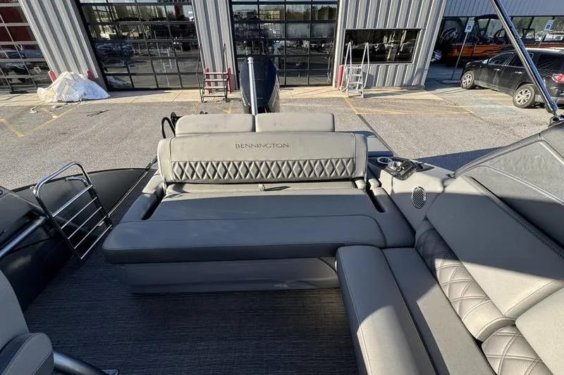 Slide: The Image of 2024 Bennington 25 QXSBA boat interior with luxurious seating and modern design. - 12