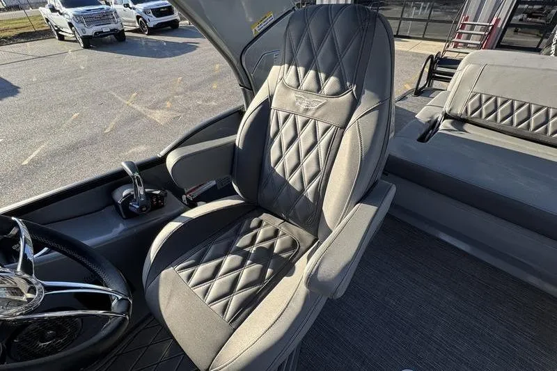 Slide: The Image of 2024 Bennington 25 QXSBA boat interior with luxurious diamond-stitched seating. - 3
