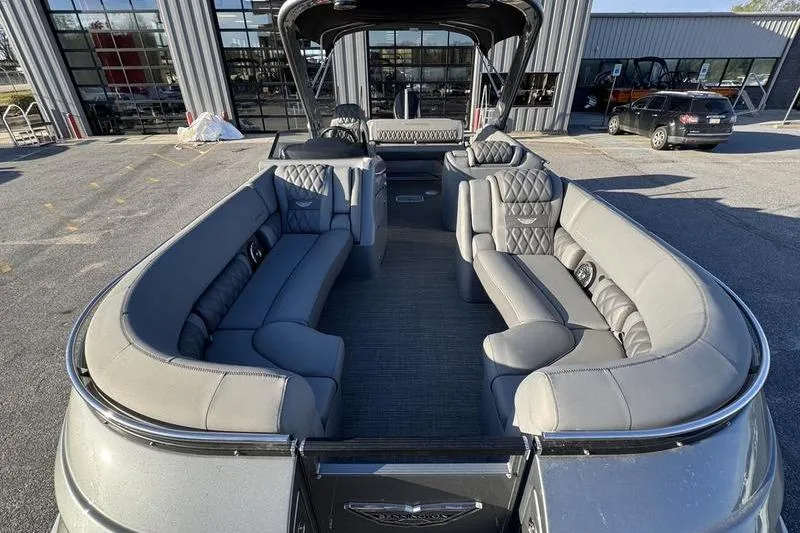 Slide: The Image of 2024 Bennington 25 QXSBA pontoon boat with luxurious seating and modern design. - 8