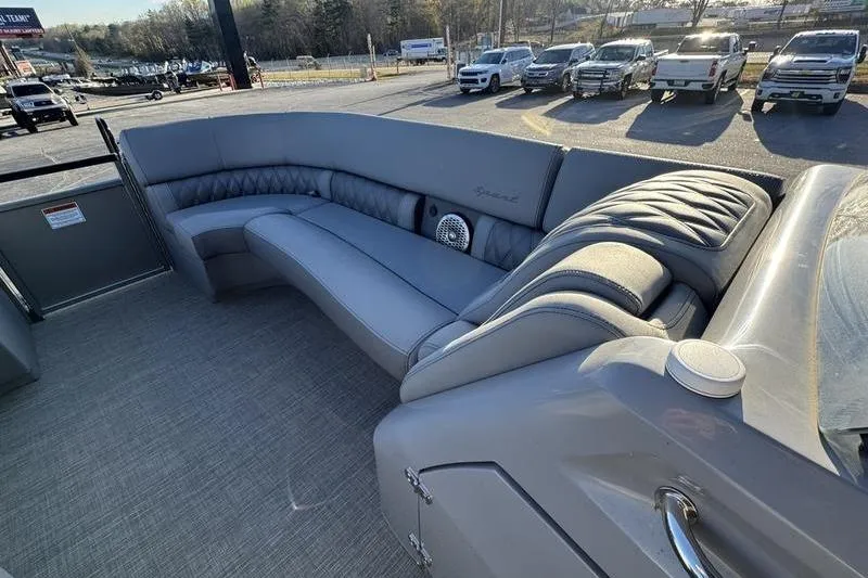 Slide: The Image of 2024 Bennington 25 QXSBA pontoon boat interior with luxurious gray seating. - 9
