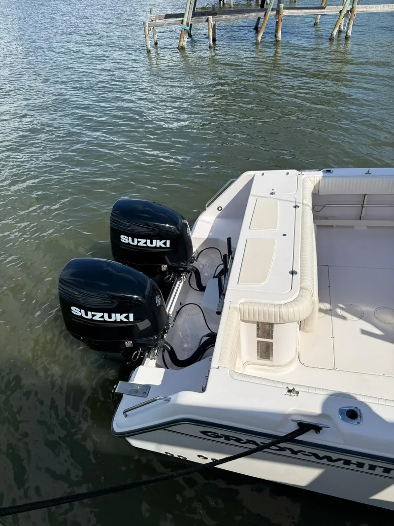 Slide: The Image of 2007 Grady-White Express 330 boat with twin Suzuki outboard motors on water. - 10