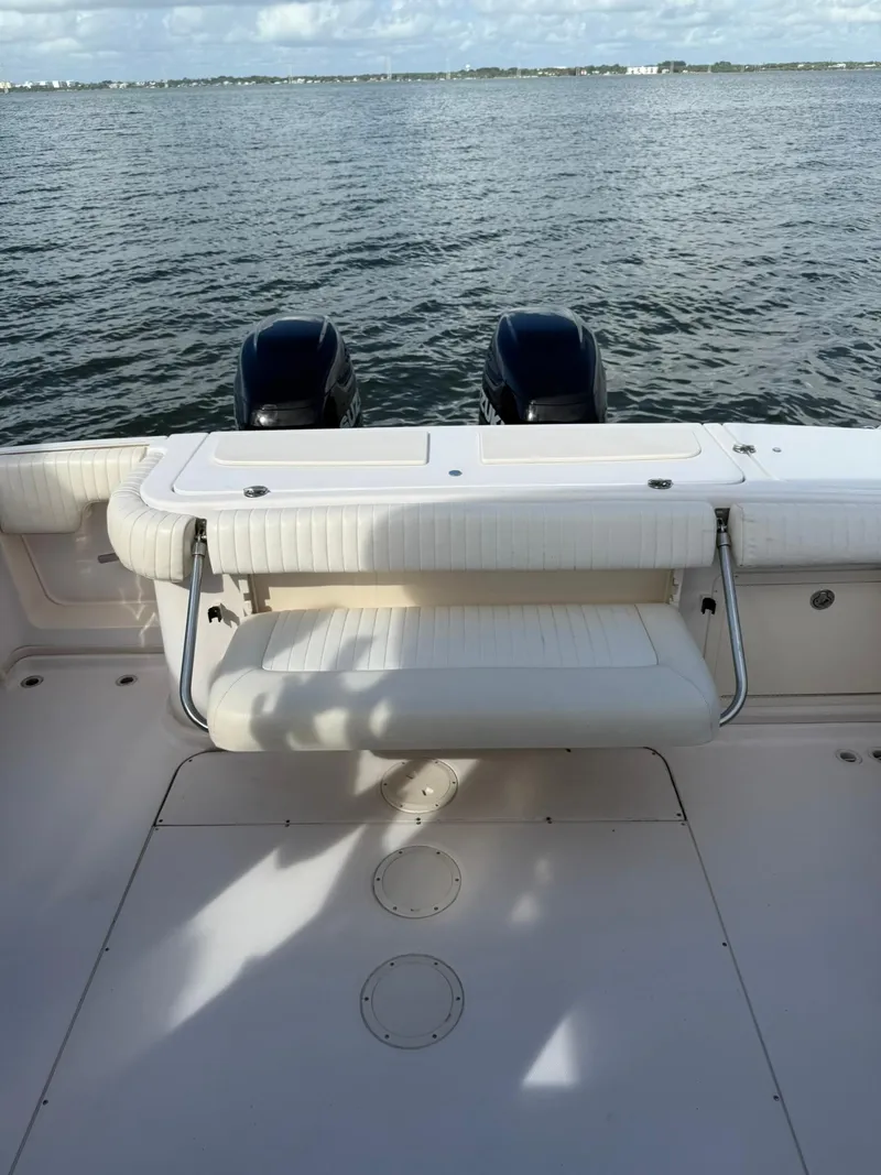 Slide: The Image of 2007 Grady-White Express 330 boat with dual engines on calm water. - 23