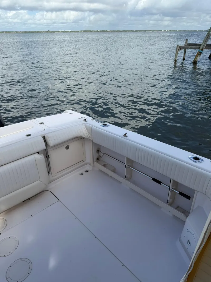 Slide: The Image of 2007 Grady-White Express 330 boat deck overlooking calm waters and cloudy sky. - 24