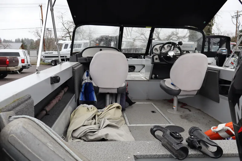 Slide: The Image of Interior of a 2021 Smoker Craft Osprey 162 boat with seating and equipment. - 6