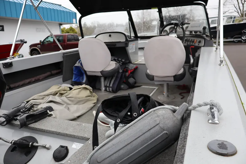 Slide: The Image of Interior view of 2021 Smoker Craft Osprey 162 boat with seats and equipment. - 7