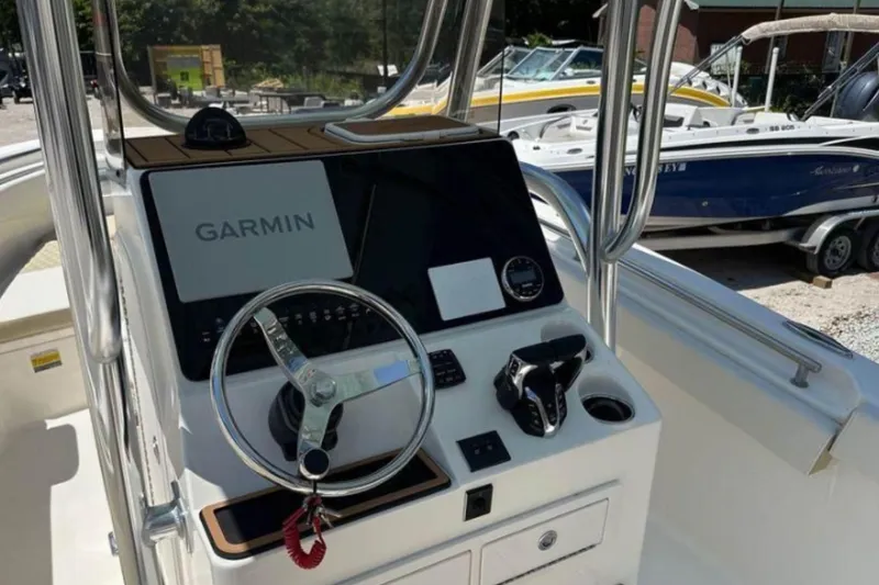 Slide: The Image of 2026 Bulls Bay 255 Center Console boat dashboard with Garmin navigation system. - 13