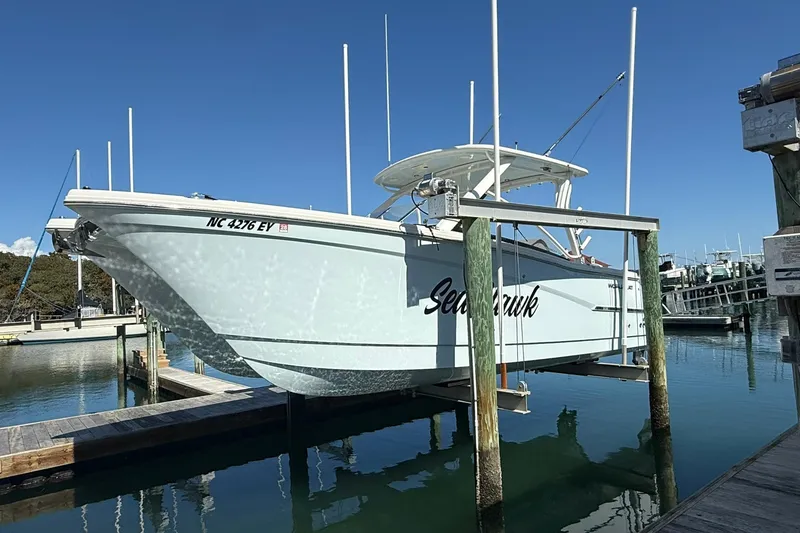 Slide: The Image of 2023 World Cat 280 DC-X boat docked, named "Seahawk," in a marina setting. - 3