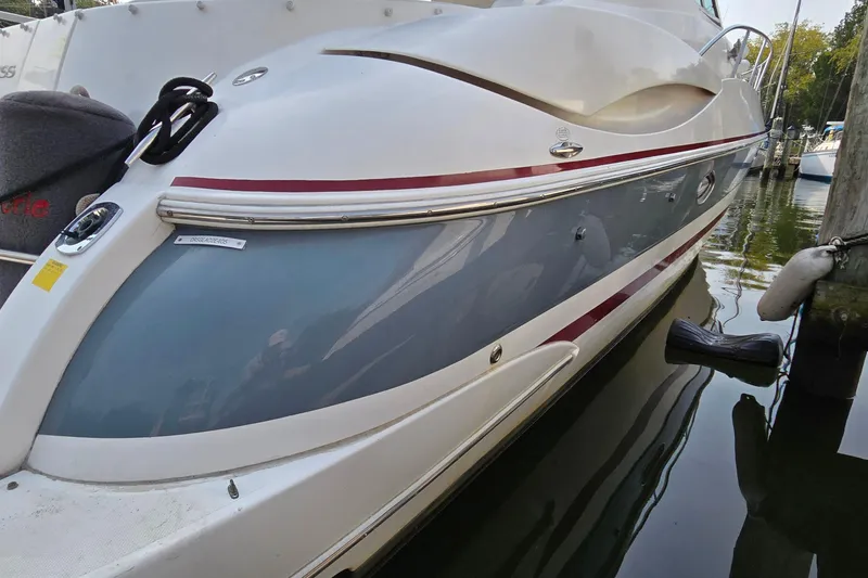 Slide: The Image of 2005 Cruisers Yachts 340 Express docked, showcasing sleek design and modern features. - 3