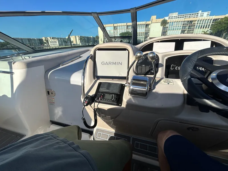 Slide: The Image of Cockpit view of a 2004 Sea Ray 340 Sundancer with Garmin navigation system. - 12