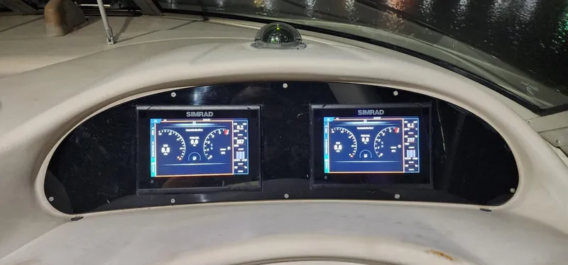Slide: The Image of Dashboard of 2004 Sea Ray 340 Sundancer with dual Simrad displays at night. - 28