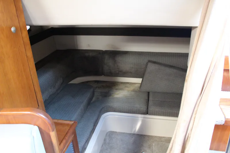 Slide: The Image of 2005 Cruisers Yachts 340 Express cabin interior with cushioned seating area. - 17
