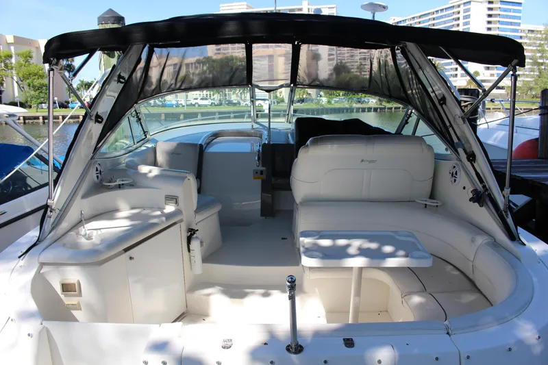 Slide: The Image of 2005 Cruisers Yachts 340 Express boat interior with seating and table. - 2