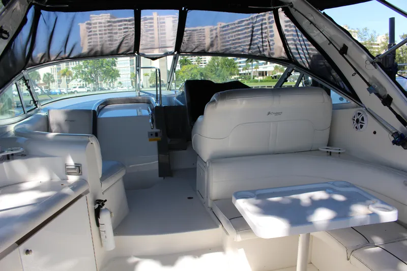 Slide: The Image of 2005 Cruisers Yachts 340 Express interior with white seating and table. - 7