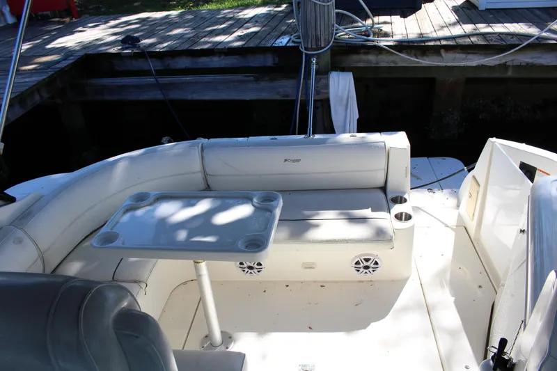 Slide: The Image of 2005 Cruisers Yachts 340 Express boat interior with seating and table. - 8