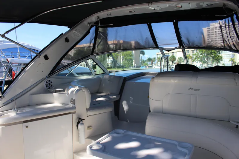 Slide: The Image of 2005 Cruisers Yachts 340 Express interior with seating and helm station. - 9