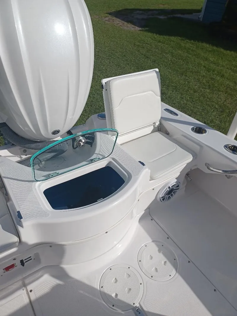 Slide: The Image of 2022 Everglades 243 Center Console boat interior with seating and storage. - 17