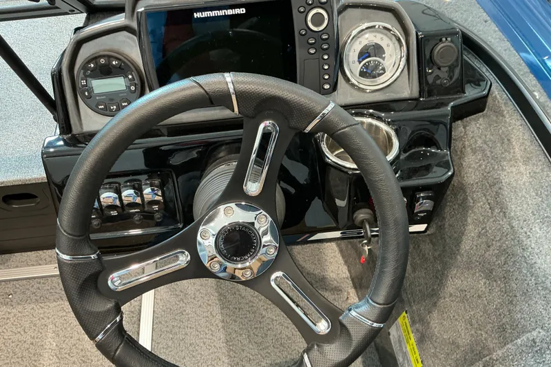Slide: The Image of Steering console of 2026 Starweld 16 SXT boat with modern controls and display. - 10