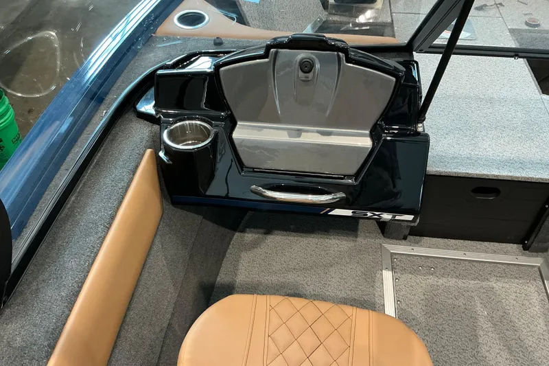 Slide: The Image of 2026 Starweld 16 SXT boat interior with cup holder and storage compartment. - 11