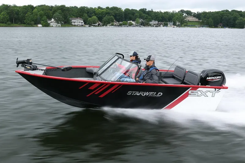 Slide: The Image of Manufacturer Provided Image: 2025 Starweld 16 SXT boat cruising on a lake with two passengers. - 2
