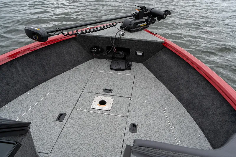 Slide: The Image of Manufacturer Provided Image: 2025 Starweld 16 SXT boat deck with Minn Kota trolling motor on water. - 3