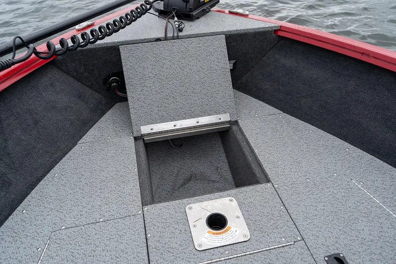 Slide: The Image of Manufacturer Provided Image: 2025 Starweld 16 SXT boat interior with storage compartment and textured flooring. - 5