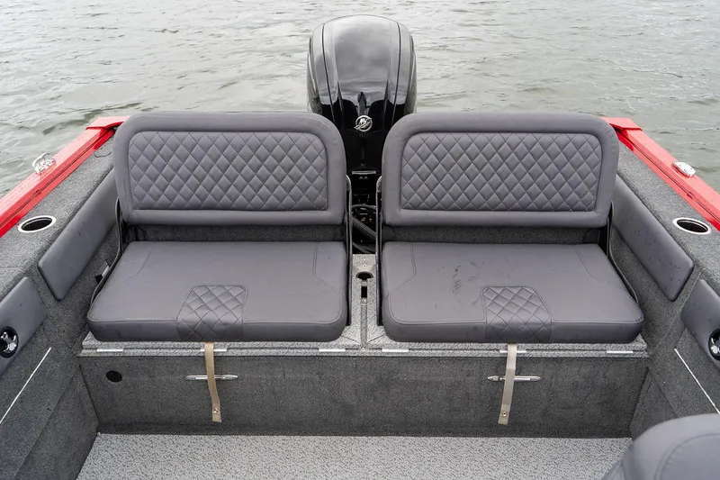 Slide: The Image of Manufacturer Provided Image: 2025 Starweld 16 SXT boat interior with gray cushioned seating and red accents. - 6